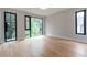 Bright bedroom features hardwood floors and large windows offering serene outdoor views at 1653 Wayland Ne Cir, Brookhaven, GA 30319