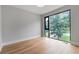 Bright bedroom featuring hardwood floors and a large window with natural light at 1653 Wayland Ne Cir, Brookhaven, GA 30319