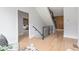 Hallway entrance to a bedroom features modern railing and lots of natural light at 1653 Wayland Ne Cir, Brookhaven, GA 30319