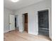Hallway with multiple doorways, closet, and view of an ensuite bathroom at 1653 Wayland Ne Cir, Brookhaven, GA 30319