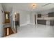 Large living room space with sleek marble floors and a staircase at 1653 Wayland Ne Cir, Brookhaven, GA 30319