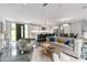 Open concept living area featuring sleek tile floors, modern furnishings, and seamless flow to outdoor living spaces at 1653 Wayland Ne Cir, Brookhaven, GA 30319