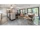 Open concept living area featuring sleek tile floors, modern furnishings, and seamless flow to outdoor living spaces at 1653 Wayland Ne Cir, Brookhaven, GA 30319