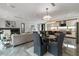 Elegant living space with a chef's kitchen featuring a marble island and open views to a dining and living area at 1653 Wayland Ne Cir, Brookhaven, GA 30319