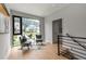 Cozy upstairs sitting area with modern furnishings and a large window view at 1653 Wayland Ne Cir, Brookhaven, GA 30319