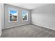 Bright bedroom with plush carpet and natural light from dual windows at 3624 Silvery Way, Powder Springs, GA 30127