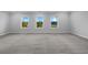 Expansive room with new carpet and many windows providing ample light at 3624 Silvery Way, Powder Springs, GA 30127