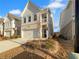 Charming new home features a two-car garage, and partial brick exterior at 3624 Silvery Way, Powder Springs, GA 30127