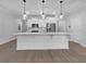 Beautiful kitchen with a large island, stainless steel appliances, and pendant lighting at 3624 Silvery Way, Powder Springs, GA 30127