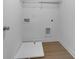 Functional laundry room with a utility sink and included shelving at 3624 Silvery Way, Powder Springs, GA 30127