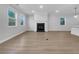 Spacious living room with fireplace, hardwood floors, and plenty of natural light at 3624 Silvery Way, Powder Springs, GA 30127