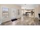 Open-concept entryway leading to dining area and kitchen, featuring wood-look flooring at 3696 Lower Burris Rd, Canton, GA 30114