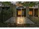 Backyard featuring gravel, stepping stones, and metal fence with a view of building balconies at 1323 Peachtree Ne Vw, Atlanta, GA 30319