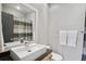 Bathroom features a modern sink, sleek faucet, and a shower with stylish striped curtain at 1323 Peachtree Ne Vw, Atlanta, GA 30319