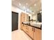 Contemporary bathroom featuring double vanity, sleek cabinets, and modern fixtures at 1323 Peachtree Ne Vw, Atlanta, GA 30319