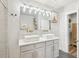 Modern bathroom featuring a double vanity, vessel sinks, and a glass-enclosed shower at 1521 Dianne Se Ct, Atlanta, GA 30316