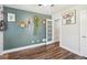 Bedroom with wood-look floors, white trim, blue accent wall, and modern decor at 1521 Dianne Se Ct, Atlanta, GA 30316