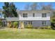 Charming two-story home featuring a bright yellow door and a well-maintained front yard at 1521 Dianne Se Ct, Atlanta, GA 30316