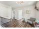 Bright hallway features hardwood floors, a modern light fixture and a cozy seating area at 1521 Dianne Se Ct, Atlanta, GA 30316