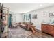 Airy living room with hardwood floors, a plush sofa, and stylishly decorated walls at 1521 Dianne Se Ct, Atlanta, GA 30316