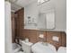 Cozy bathroom featuring brown tiling, shower-tub combo, and modern fixtures at 300 Peachtree St # 23-A, Atlanta, GA 30308