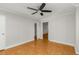 Bright bedroom featuring a modern ceiling fan and doorways to the hall and a large closet at 300 Peachtree St # 23-A, Atlanta, GA 30308