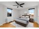 Bedroom featuring parquet floors and modern furnishings with natural light from windows at 300 Peachtree St # 23-A, Atlanta, GA 30308