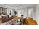 Comfortable living room showcases natural light, neutral tones and parquet wood floors at 300 Peachtree St # 23-A, Atlanta, GA 30308