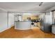 Living room showcasing open concept layout to kitchen with modern stainless appliances at 300 Peachtree St # 23-A, Atlanta, GA 30308