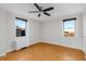 Bright main bedroom with large windows, hardwood floors, and a ceiling fan at 300 Peachtree St # 23-A, Atlanta, GA 30308