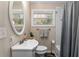 Well-lit bathroom with a white vanity, oval mirror, subway tile shower, and neutral color scheme at 3430 Pinehill Dr, Decatur, GA 30032