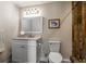 Well-lit bathroom with a modern vanity and a walk-in shower with wood accents at 3430 Pinehill Dr, Decatur, GA 30032