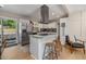 Modern kitchen with an island and stainless steel appliances flowing into an open layout at 3430 Pinehill Dr, Decatur, GA 30032