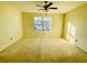 Expansive main bedroom with a ceiling fan and lots of natural light from the large window at 5070 Oakley Commons Blvd, Union City, GA 30291