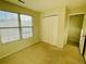 Cozy bedroom with natural light from the large window and an ample-sized closet at 5070 Oakley Commons Blvd, Union City, GA 30291