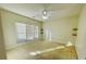 Spacious bedroom with a ceiling fan and natural light from a large window at 5070 Oakley Commons Blvd, Union City, GA 30291