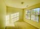 Bright bedroom featuring neutral walls and a large window that brings in natural light at 5070 Oakley Commons Blvd, Union City, GA 30291