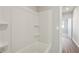 Bathroom showcasing a bathtub, shelves, and modern lighting at 83 Arnold Poplar Ln, Auburn, GA 30011