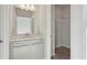 Bathroom showcasing a vanity with gray cabinets and a walk-in closet at 83 Arnold Poplar Ln, Auburn, GA 30011