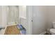 Bathroom featuring a glass enclosed shower, single sink, and white cabinets at 83 Arnold Poplar Ln, Auburn, GA 30011