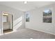 Bedroom with carpet, two windows, neutral walls, and access to the en-suite bathroom at 83 Arnold Poplar Ln, Auburn, GA 30011