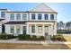 Charming two-story townhome featuring a black metal roof and eye-catching black-framed windows at 83 Arnold Poplar Ln, Auburn, GA 30011