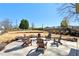 Outdoor seating area with chairs around a firepit, ideal for gatherings and relaxing outdoors at 83 Arnold Poplar Ln, Auburn, GA 30011