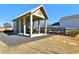 Exterior shot of a well-maintained gazebo with a picnic table and stone landscaping at 83 Arnold Poplar Ln, Auburn, GA 30011