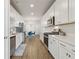 Modern kitchen with stainless steel appliances and white cabinetry at 83 Arnold Poplar Ln, Auburn, GA 30011