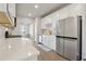 Well-lit kitchen with quartz countertops and modern appliances at 83 Arnold Poplar Ln, Auburn, GA 30011