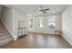 Bright and airy living room featuring recessed lighting, hardwood floors, and access to outdoor space at 83 Arnold Poplar Ln, Auburn, GA 30011