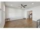 Spacious living room featuring hardwood floors, abundant natural light, and easy access to the kitchen area at 83 Arnold Poplar Ln, Auburn, GA 30011