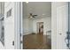 Inviting living room with modern ceiling fan, hardwood floors, and a clear view into the kitchen at 83 Arnold Poplar Ln, Auburn, GA 30011