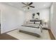 Serene main bedroom featuring a neutral color palette, plush bedding, and ample natural light at 83 Arnold Poplar Ln, Auburn, GA 30011